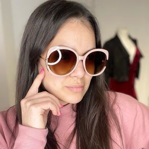 Mauve pink round frame sunglasses with gold hardware